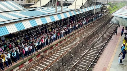 People Waiting for Local train rush at CSMT station. 4K (Night View). Stock Footage 249250773