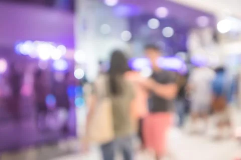 People waiting up a queue at ATM in department store, Blurred background Stock Photos