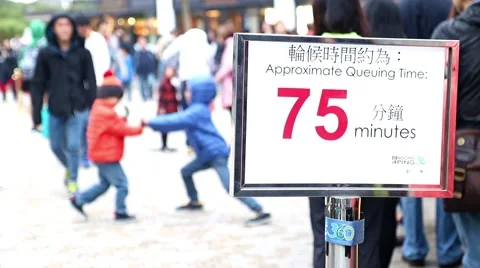 People waiting in queue for the lift, focus on the information sign Stock Footage 62714093