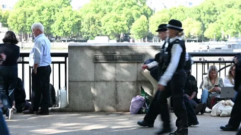 People waiting in queue on South Bank to see the Queen Lying in State Stock Footage 210501682