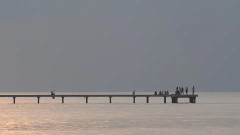 People waiting sunset time at the pier Stock Footage 320148733
