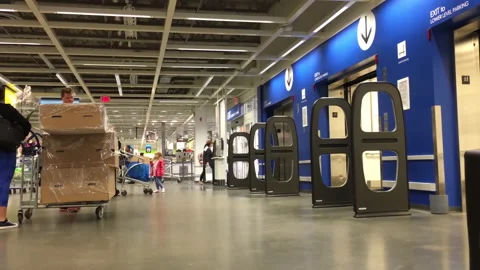 People waiting to take the elevator inside the Ikea store Stock Footage 159575356