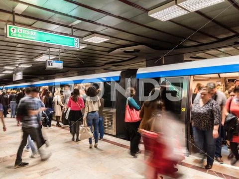 People Waiting For Train In Central Subway Station