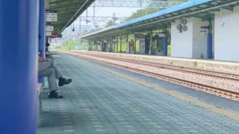 People waiting for the train on the platform Stock Footage 311575895