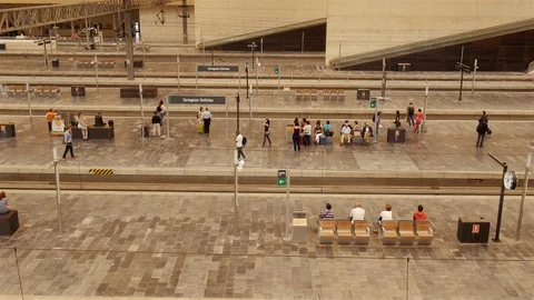 People waiting for the train on the platform of the Zaragoza railway station. Stock Footage 98498227