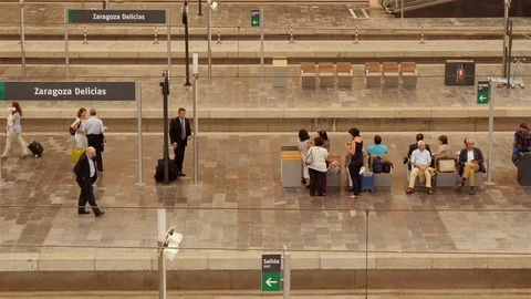 People waiting for the train on the platform of the Zaragoza railway station.. Stock Footage 98498938
