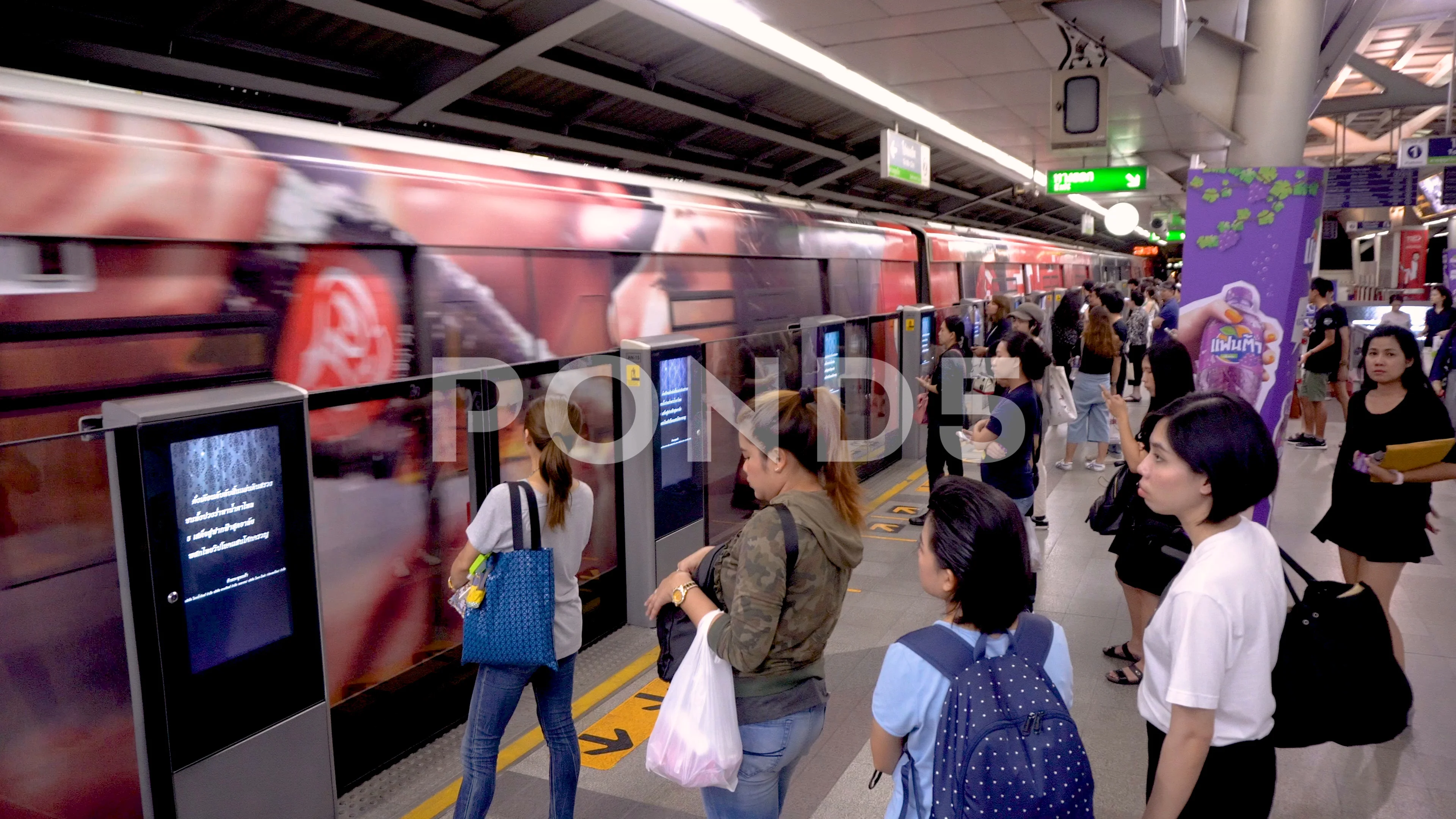 People waiting for a train on Opéra metro station in Paris .The