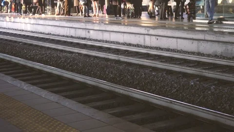 People waiting for the train at the station Stock Footage 70553443