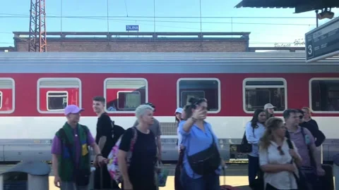 People waiting at the train station, view from passing train Stock Footage 196132115