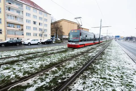 People waiting walking the platform while waiting descending for tram on a sn Stock Photos