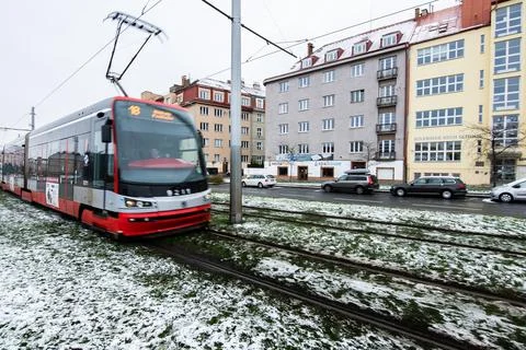 People waiting walking the platform while waiting descending for tram on a sn Stock Photos
