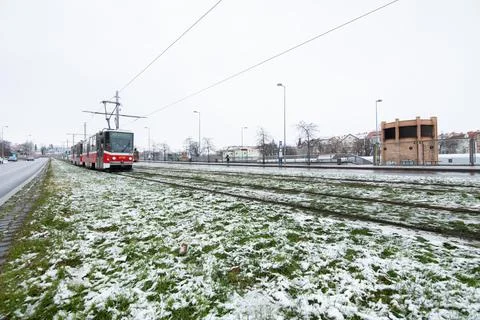 People waiting walking the platform while waiting descending for tram on a sn Stock Photos