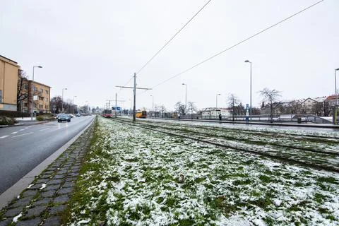 People waiting walking the platform while waiting descending for tram on a sn Stock Photos
