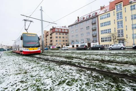 People waiting walking the platform while waiting descending for tram on a sn Stock Photos
