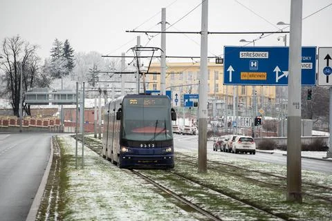 People waiting walking the platform while waiting descending for tram on a sn Stock Photos