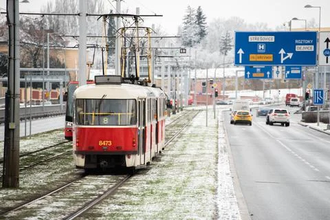 People waiting walking the platform while waiting descending for tram on a sn Stock Photos