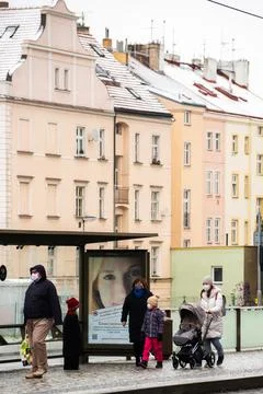 People waiting walking the platform while waiting descending for tram on a sn Stock Photos