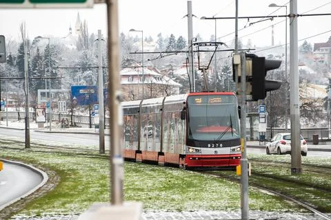 People waiting walking the platform while waiting descending for tram on a sn Stock Photos