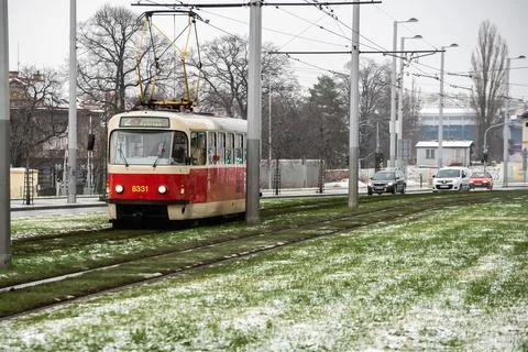 People waiting walking the platform while waiting descending for tram on a sn Stock Photos