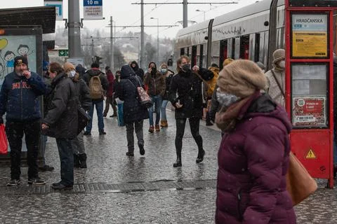 People waiting walking the platform while waiting descending for tram on a sn Stock Photos