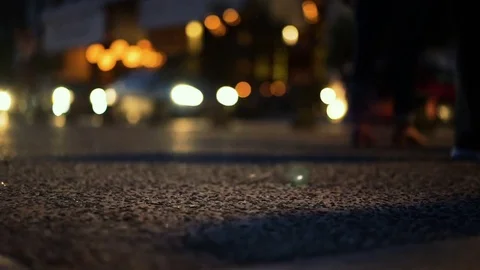 People waking at night, focus in foreground, slow motion, slow shutter effect Stock Footage 77752570