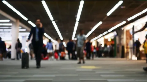 People walk in airport blur timelapse Stock Footage