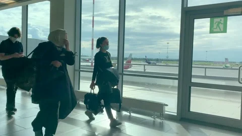 People walk along the arrival corridor at the airport Stock-Footage 139745368