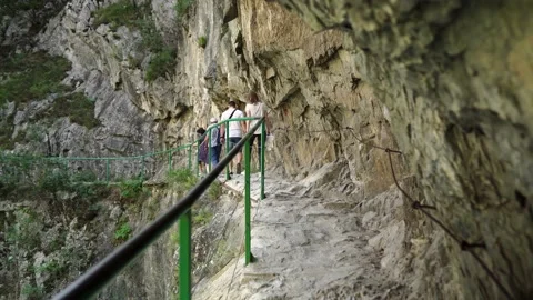 People walk along a mountain path in Matka Canyon Stock Footage 173504803