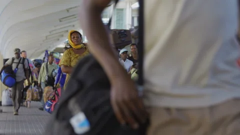 People Walk Along Side Of A Train In A Station.DaresSalaam Tanzania Stock Footage 131421300
