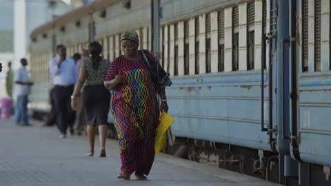 People Walk Along Side Of A Train In A Station.DaresSalaam Tanzania Stock Footage 131478420