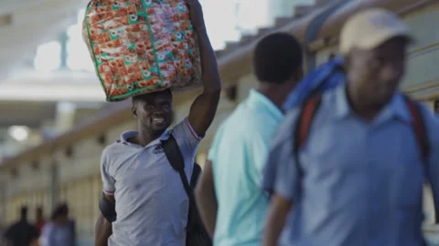 People Walk Along Side Of A Train In A Station.DaresSalaam Tanzania Видео 131485408