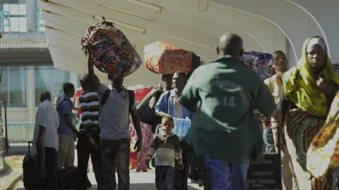 People Walk Along Side Of A Train In A Station.DaresSalaam Tanzania Stock Footage 131491842
