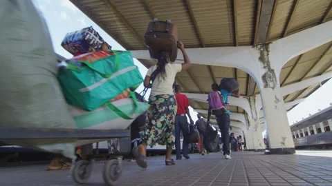 People Walk Along Side Of A Train In A Station.DaresSalaam Tanzania Stock-Footage 131989941