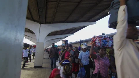 People Walk Along Side Of A Train In A Station.DaresSalaam Tanzania 動画素材 131991436
