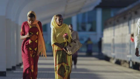 People Walk Along Side Of A Train In A Station.DaresSalaam Tanzania Stock Footage 132228109