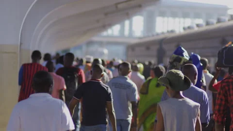 People Walk Along Side Of A Train In A Station.DaresSalaam Tanzania Stock Footage 132533349