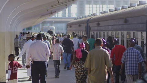 People Walk Along Side Of A Train In A Station.DaresSalaam Tanzania Stock-Footage 132534720