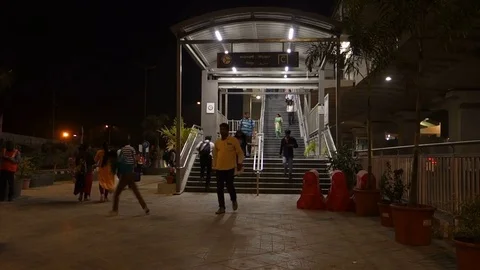 People walk up and down the stairs at Metro Rail Station in India Stock Footage 83769090