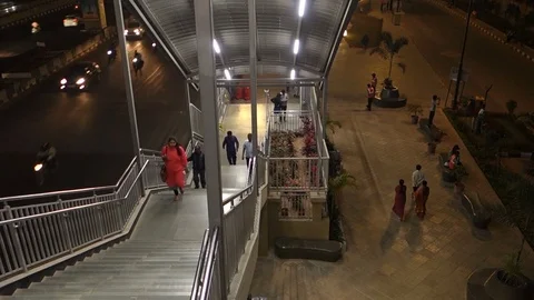 People walk up and down the stairs at Metro Rail Station in India Stock Footage 83786142