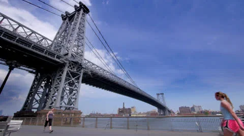 People Walk and Exercise under bridge in NYC Stock Footage 24620552