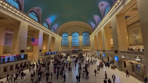 People walk around the Main Concourse at Grand Central Terminal. New York City 動画素材 337837922