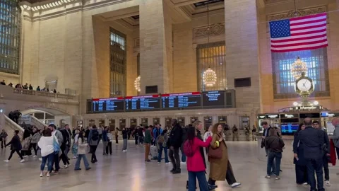 People walk around the Main Concourse at Grand Central Terminal. New York City Stock Footage 337837943