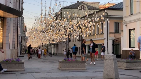People walk around Moscow at the intersection of Stoleshnikov Lane Stock Footage 114079627