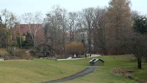 People walk on botanical garden paths, Berlin, Germany Stock Footage