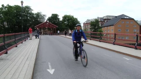 People walk by the bridge in Trondheim, Norway. Stock Footage 59656385