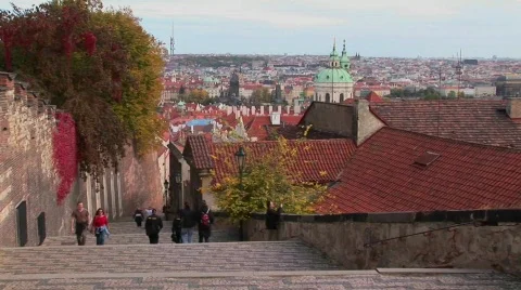 People walk on the cobblestone streets of Prague, Czech Republic. Stock Footage