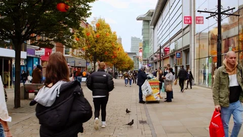 People walk down busy street during coronavirus outbreak. Stock Footage