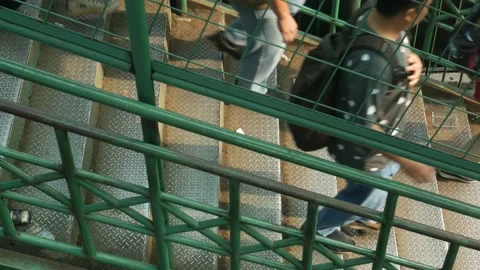 People walk down on a stair Stock Footage 169377686