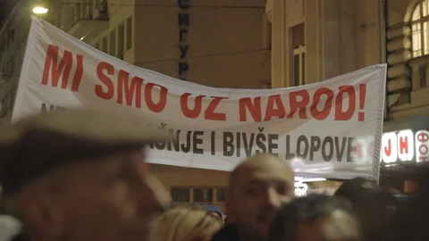 People walk during a protest in Belgrade. Stock Footage 102371709