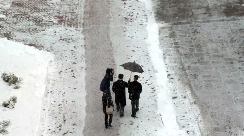 People walk during a snowfall. Stock Footage 55704640
